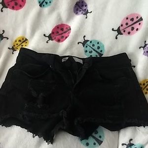 Black shorts with holes